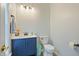 Bathroom with blue vanity, modern sink, and contemporary design at 750 Raymond Dr, Clayton, NC 27527