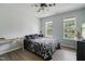 Bright bedroom with large windows, hardwood floors, and decorative furniture at 750 Raymond Dr, Clayton, NC 27527