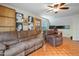 Upstairs bonus room with hardwood floors, comfortable seating and a ceiling fan at 750 Raymond Dr, Clayton, NC 27527
