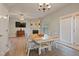 Open-concept space featuring dining table, fireplace, and hardwood floors at 750 Raymond Dr, Clayton, NC 27527