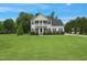 Charming two-story home with a beautifully maintained lawn and traditional architectural details at 750 Raymond Dr, Clayton, NC 27527