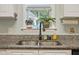 Close-up of kitchen sink with granite countertops and a window view at 750 Raymond Dr, Clayton, NC 27527