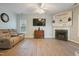 Comfortable living room featuring a fireplace and hardwood floors at 750 Raymond Dr, Clayton, NC 27527