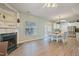 Open-concept living and dining space with fireplace, hardwood floors, and natural light at 750 Raymond Dr, Clayton, NC 27527