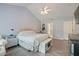 Spacious bedroom with vaulted ceiling, ceiling fan, and ensuite bathroom entrance at 750 Raymond Dr, Clayton, NC 27527