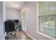 Home office with hardwood floors, bright windows, and decorative furniture at 750 Raymond Dr, Clayton, NC 27527