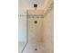 Modern shower with glass door, mosaic tile accents, and updated fixtures at 750 Raymond Dr, Clayton, NC 27527