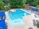 Overhead view of a community pool with marked lanes and plenty of seating available at 7520 Milestone Ct, Raleigh, NC 27615