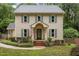 Charming two-story home with a well-manicured front yard and an American flag at 7520 Milestone Ct, Raleigh, NC 27615
