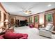 Comfortable living room features a fireplace and abundant natural light at 7520 Milestone Ct, Raleigh, NC 27615