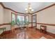 Elegant living room with hardwood floors, decorative moldings, and bright windows at 7520 Milestone Ct, Raleigh, NC 27615