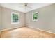 Bedroom features hardwood floors, two windows providing plenty of natural light and a ceiling fan at 7603 Nichols Dr, Rougemont, NC 27572
