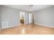 Bedroom with hardwood floors and access to the bathroom at 7603 Nichols Dr, Rougemont, NC 27572
