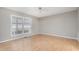 Bright bedroom with hardwood floors, a ceiling fan and a large window providing natural light at 7603 Nichols Dr, Rougemont, NC 27572