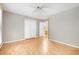 Light-filled bedroom showcasing a double door closet, wood floors, and neutral paint for versatile styling at 7603 Nichols Dr, Rougemont, NC 27572