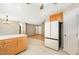 Spacious kitchen adjacent to the living room with white appliances and ample countertop space at 7603 Nichols Dr, Rougemont, NC 27572