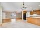 Open concept kitchen and living area featuring tile flooring, modern appliances, and natural light at 7603 Nichols Dr, Rougemont, NC 27572