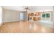Open concept living space featuring laminate flooring and access to the kitchen area at 7603 Nichols Dr, Rougemont, NC 27572