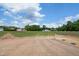 Large backyard area with expansive green space and room for activities, set against a backdrop of mature trees at 7719 Barefoot Rd, Fuquay Varina, NC 27526