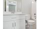 Bathroom featuring white cabinets, a sink, a toilet, and a shower/tub combination for a functional design at 7719 Barefoot Rd, Fuquay Varina, NC 27526
