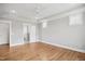 Neutral main bedroom with hardwood floors, ensuite bathroom access, and natural light at 7719 Barefoot Rd, Fuquay Varina, NC 27526