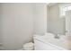 Neutral powder room featuring a modern vanity with quartz countertop and a sleek toilet at 7719 Barefoot Rd, Fuquay Varina, NC 27526