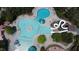 Overhead view of a community pool area featuring a slide, splash pad, and plenty of space for relaxation and recreation at 78 Salt Cedar Ln, Chapel Hill, NC 27516