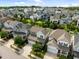 Aerial shot shows houses in a neighborhood with mature trees and lush green yards at 78 Salt Cedar Ln, Chapel Hill, NC 27516