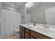 Bathroom features a double sink vanity, a large mirror and a toilet behind a shower curtain at 78 Salt Cedar Ln, Chapel Hill, NC 27516