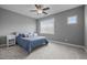 Bright bedroom featuring a light blue bed, neutral decor, and a large window at 78 Salt Cedar Ln, Chapel Hill, NC 27516