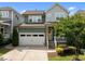 Inviting two-story home with an attached two-car garage, covered porch and well-maintained landscaping at 78 Salt Cedar Ln, Chapel Hill, NC 27516
