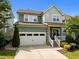 Charming two-story home with a two-car garage, a quaint front porch, and beautiful landscaping in a vibrant community at 78 Salt Cedar Ln, Chapel Hill, NC 27516