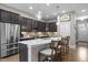 Beautiful kitchen with stainless steel appliances, spacious island, and dark cabinetry at 78 Salt Cedar Ln, Chapel Hill, NC 27516
