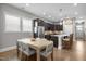 Stylish kitchen with dark cabinets, stainless steel appliances, and a cozy breakfast nook at 78 Salt Cedar Ln, Chapel Hill, NC 27516