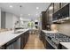 Well-equipped kitchen with stainless steel appliances and an island, open to the living area at 78 Salt Cedar Ln, Chapel Hill, NC 27516