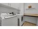 Laundry room with appliances, built-in cabinets and counter at 78 Salt Cedar Ln, Chapel Hill, NC 27516