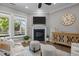 Comfortable living area with a fireplace, built-in shelving, and stylish furnishings at 78 Salt Cedar Ln, Chapel Hill, NC 27516
