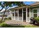 Screened patio with outdoor lighting and landscaping at 78 Salt Cedar Ln, Chapel Hill, NC 27516