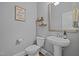 Stylish half bath with gray walls and modern vanity at 78 Salt Cedar Ln, Chapel Hill, NC 27516
