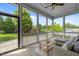 Relaxing screened porch with comfortable seating and a view of the backyard at 78 Salt Cedar Ln, Chapel Hill, NC 27516