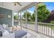 Cozy screened porch with a ceiling fan, offering a pleasant outdoor living space at 78 Salt Cedar Ln, Chapel Hill, NC 27516