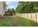 Fenced backyard with deck stairs at 7936 Milltrace, Raleigh, NC 27615