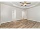 Spacious bedroom with modern ceiling fan and hardwood style flooring at 7936 Milltrace, Raleigh, NC 27615