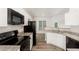 Kitchen featuring white cabinets, granite countertops, and stainless steel appliances at 7936 Milltrace, Raleigh, NC 27615