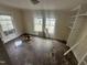 Spacious room with large windows, hardwood floors, and built in shelving providing a bright and airy atmosphere at 0 Chapel Hill Rd, Durham, NC 27707