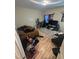 Bedroom with laminate wood flooring, cluttered decor, and a window at 0 Chapel Hill Rd, Durham, NC 27707