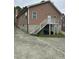 Back exterior of home showing siding, elevated deck, and basement foundation at 0 Chapel Hill Rd, Durham, NC 27707