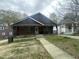 Home with a large, covered front porch and an overcast sky at 0 Chapel Hill Rd, Durham, NC 27707