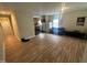 Open living space with laminate wood flooring flowing into the kitchen and dining area at 0 Chapel Hill Rd, Durham, NC 27707