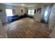 Open living space with laminate wood flooring, sofa, chairs, and a large window at 0 Chapel Hill Rd, Durham, NC 27707